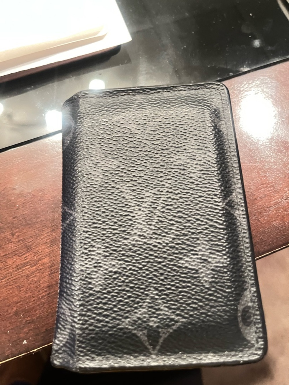 Authentic LV Black Leather Card Holder one year old in great condition!
